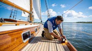 Marine surveyor inspecting a sailboat in North Carolina waters